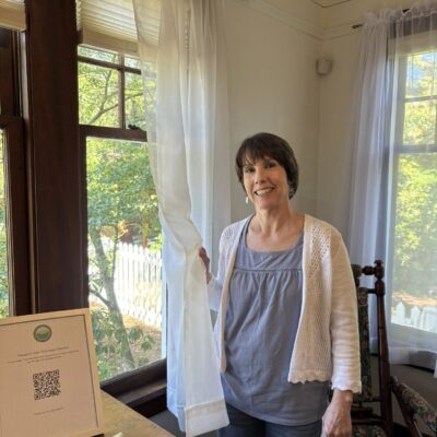 Kathy Maloney helping with Curtains DeYoung House
